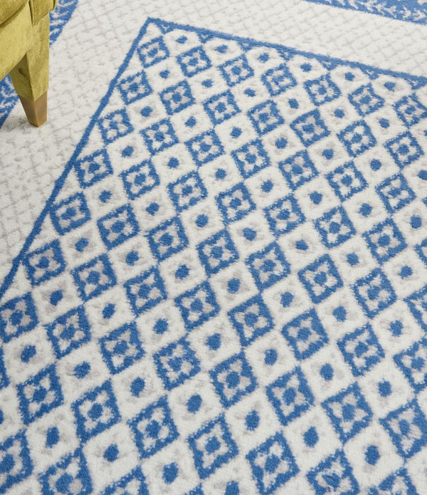 5’ x 7’ Ivory and Blue Geometric Area Rug