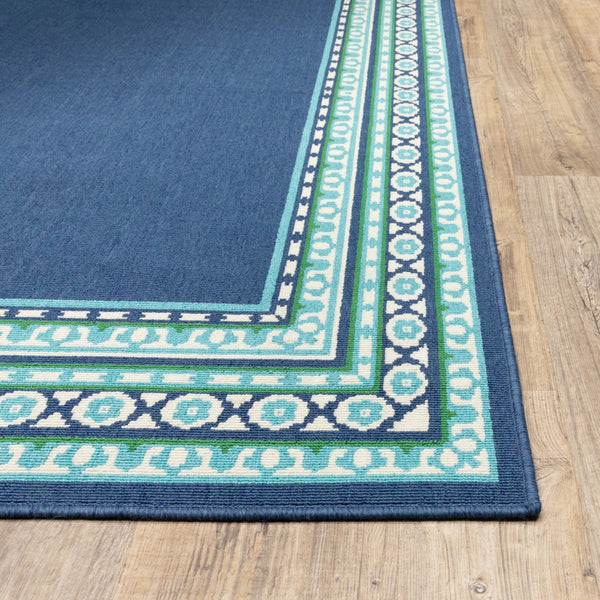 7’x10’ Navy and Green Geometric Indoor Outdoor Area Rug